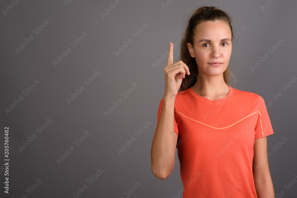 Young beautiful woman with long blond hair ready for gym against Young beautiful woman with long blond hair ready for gym against