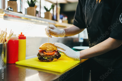 Chef prepares burger, fast food cooking