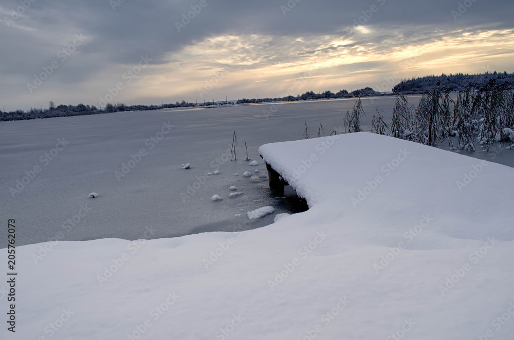 lake pier at sunset in winter