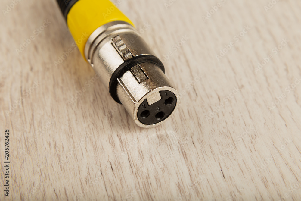 Female XLR connector for microphone connection . Female XLR connector for microphone connection .