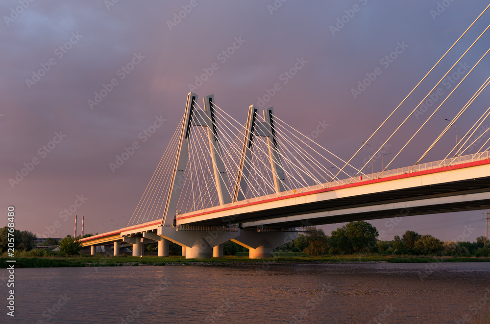Fototapeta premium Cable stayed bridge, Krakow, Poland, during sunset over Vistula river