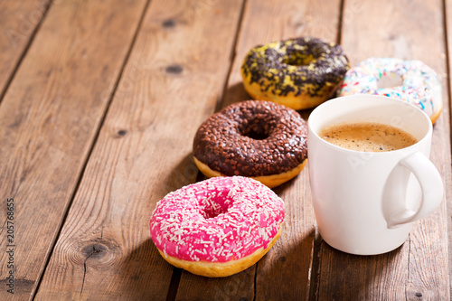 Fototapeta cup of coffee with donuts
