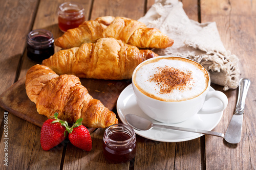 Fototapeta Naklejka Na Ścianę i Meble -  Breakfast with cup of cappuccino coffee with croissants