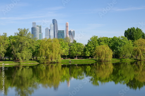 The spring view on the Great Novodevichy Pond with modern Moscow-city buildings on the background, Moscow, Russia