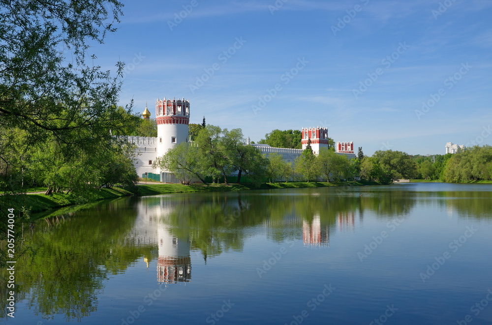 Spring view of the Novodevichy Monastery from the pond in Moscow city, Russia