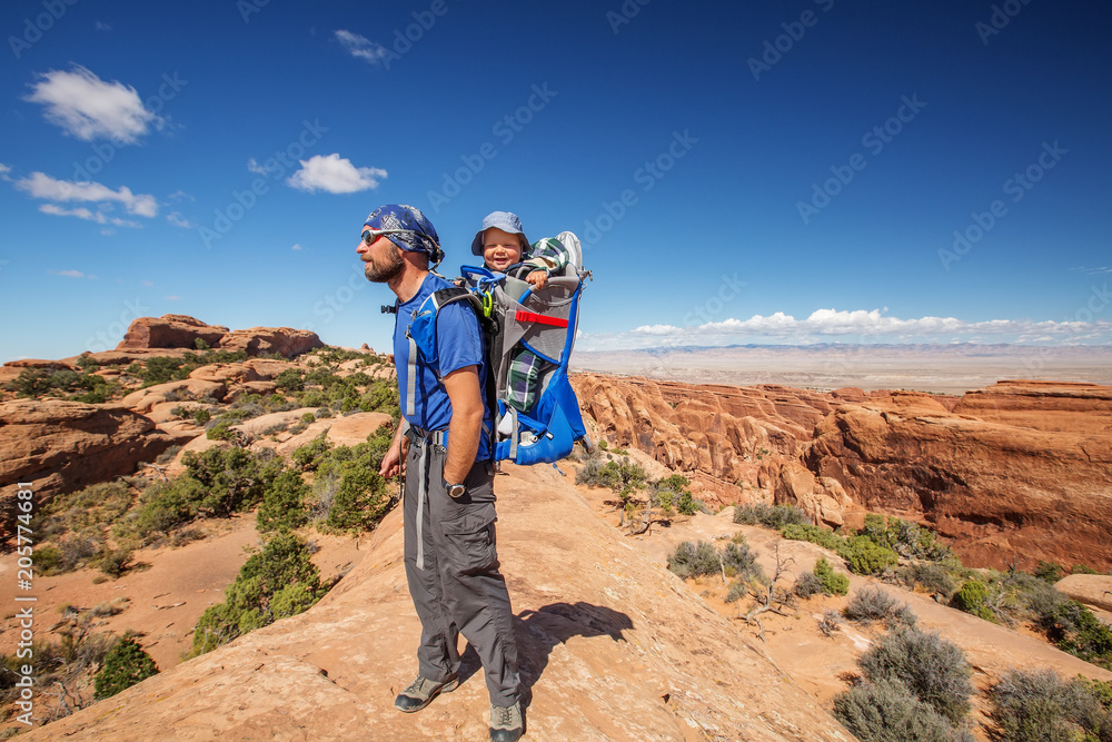 A family with baby son visits Arches National Park in Utah, USA A family with baby son visits Arches National Park in Utah, USA