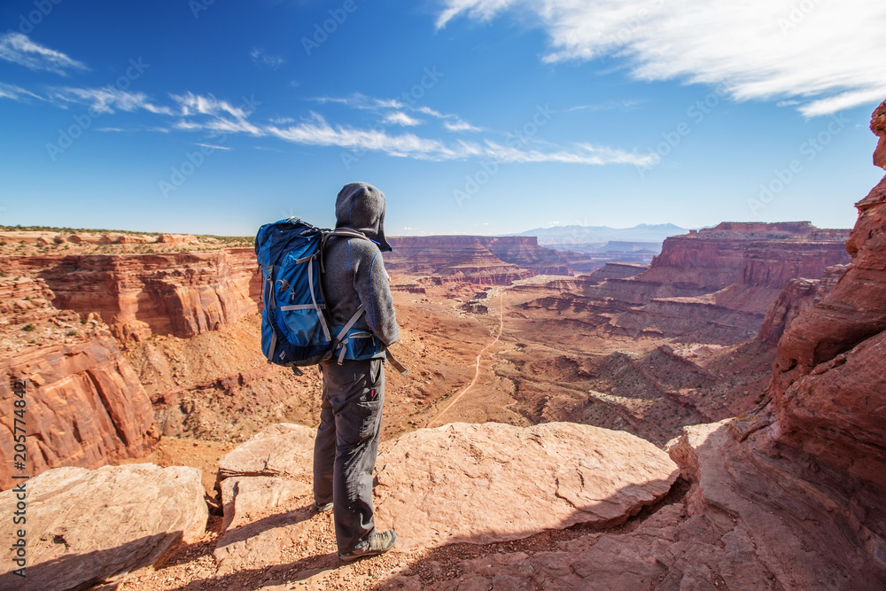 Hiker in Canyonlands National park in Utah, USA Hiker in Canyonlands National park in Utah, USA