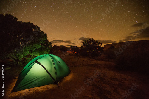 Tent lit with light in the wilderness of Utah, USA