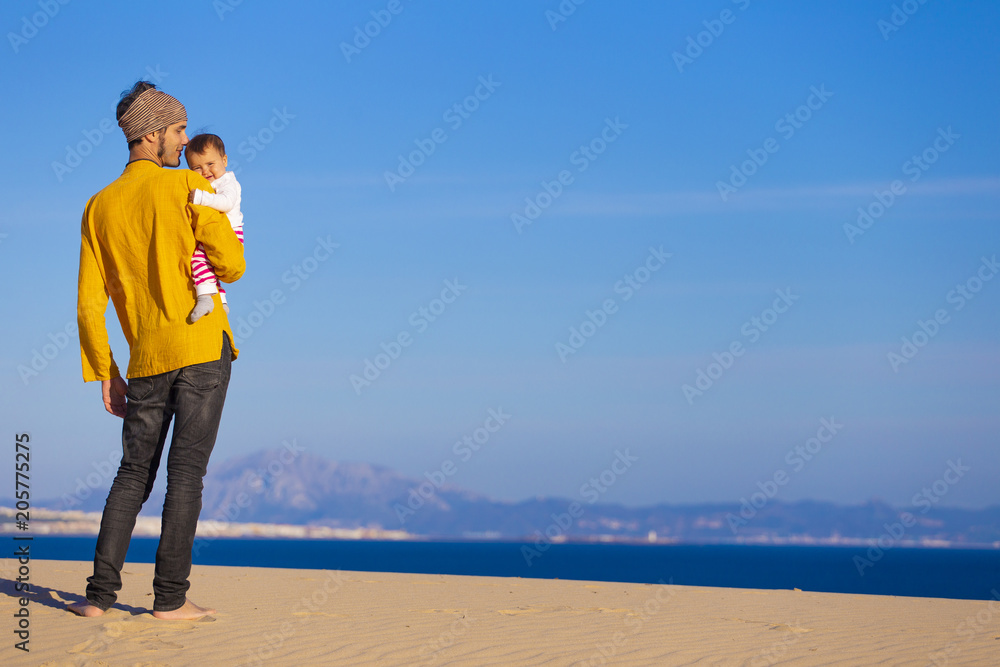 Dad and baby daughter in the beach Dad and baby daughter in the beach