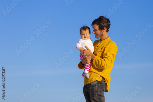 Dad and baby daughter in the beach