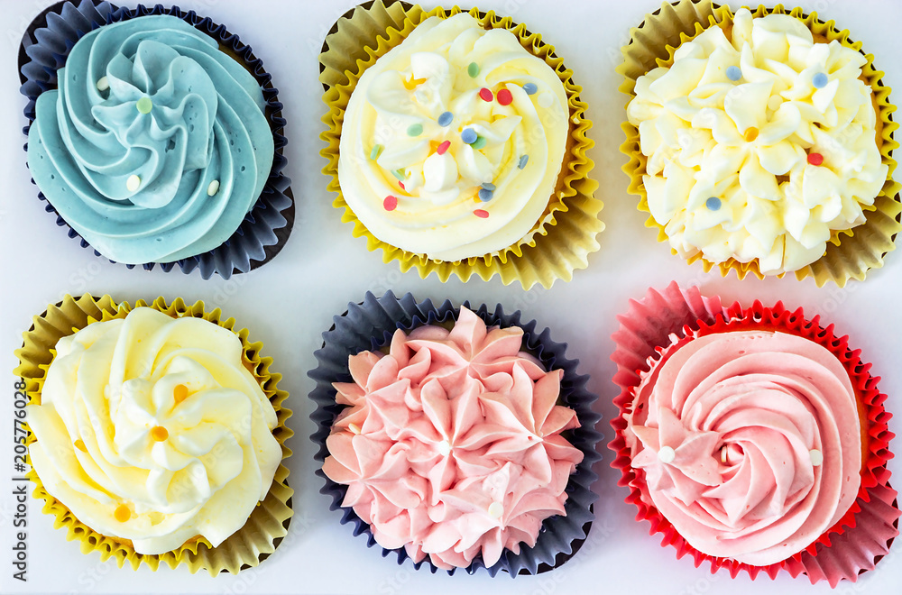 Set different delicious homemade cupcakes butter cream paper delivery box. Top view. Set different delicious homemade cupcakes butter cream paper delivery box. Top view.