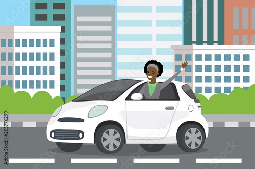 Fototapeta Naklejka Na Ścianę i Meble -  young happy african american woman auto driver rides in white car,