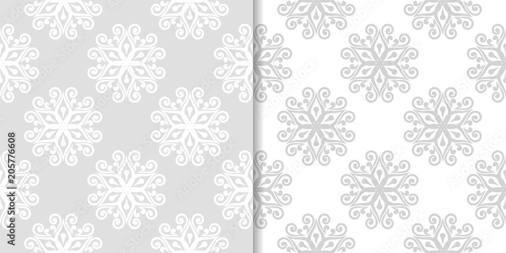 Light gray floral backgrounds. Set of seamless patterns Light gray floral backgrounds. Set of seamless patterns