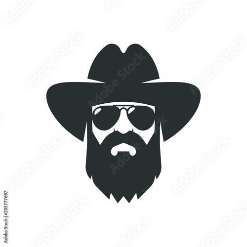 Carta da parati Bearded cowboy in sunglasses and in a hat. Cool American man