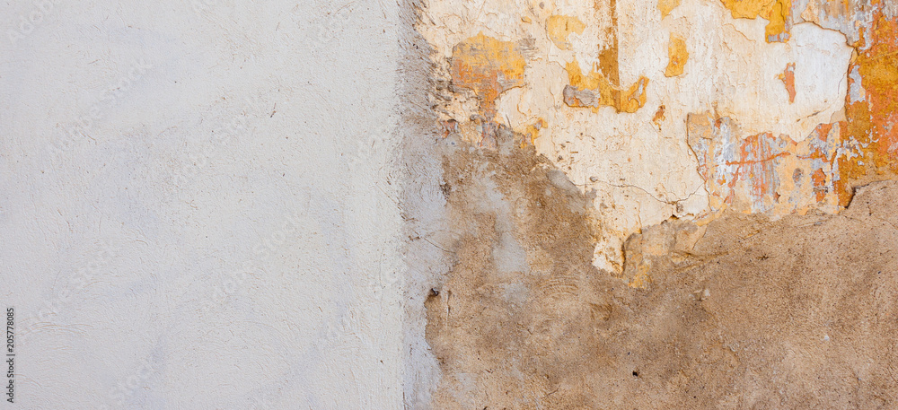 Fototapeta premium Beige new plastered wall with damaged old painted wall as banner background