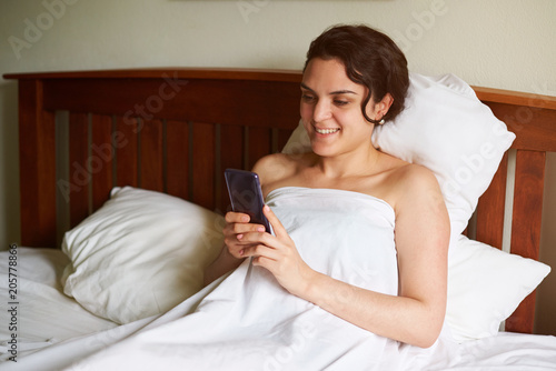 Happy smiling woman with smartphone