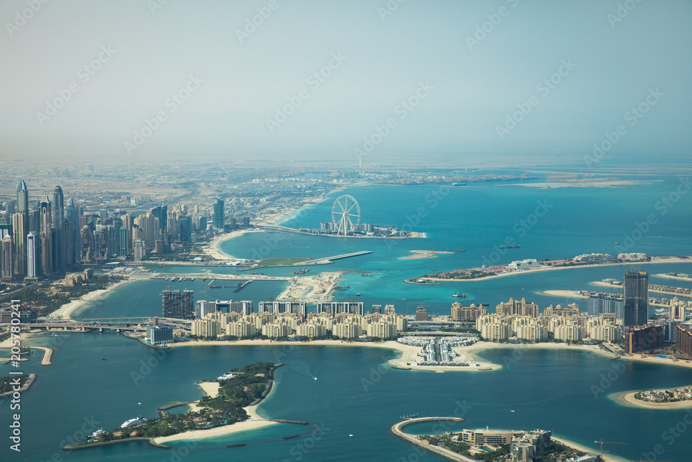 Dubai Eye and Marina district behind Palm Jumeirah man made island.