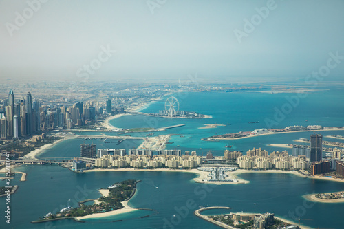 Dubai Eye and Marina district behind Palm Jumeirah man made island.