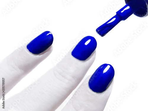 Painting nails with blue lacquer