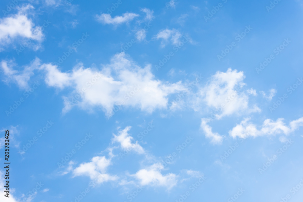 Blue sky with torn white formless clouds. Blue sky with torn white formless clouds.