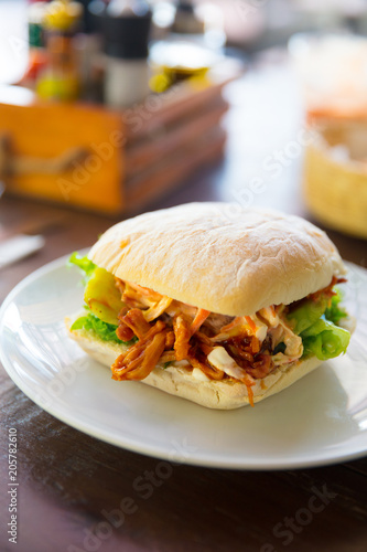 Delicious Pulled Pork Burger Served On Restaurant Table