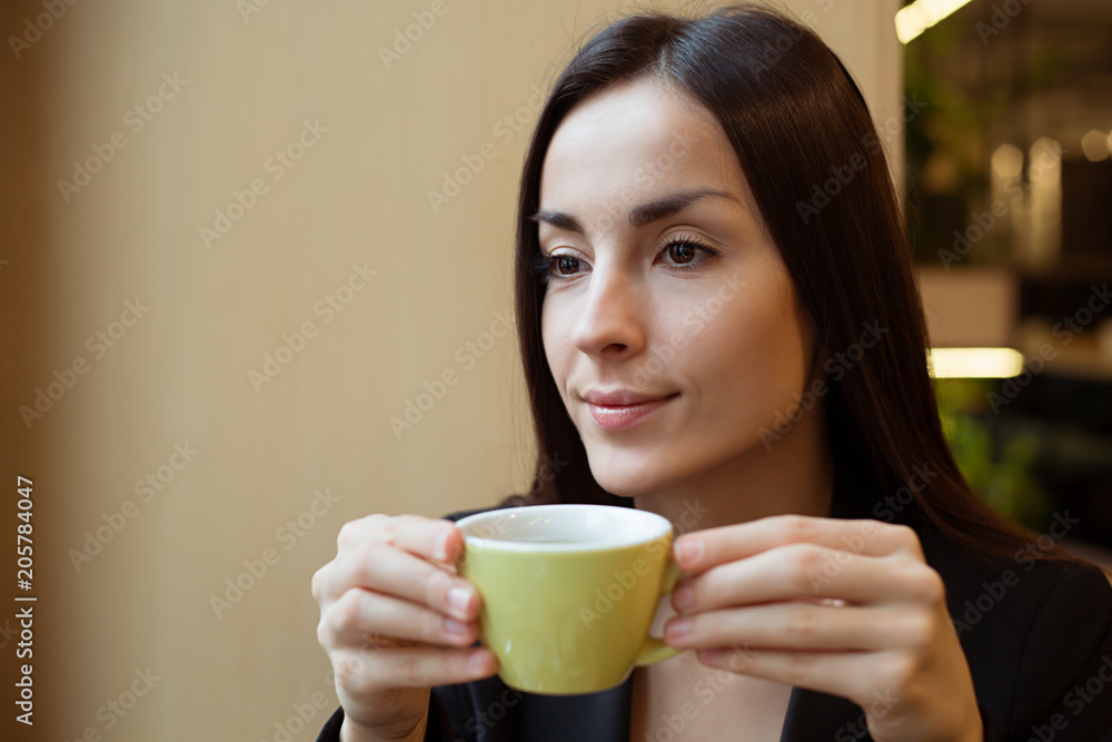 Relax Business Woman enjoying coffee in coffee shop while break Relax Business Woman enjoying coffee in coffee shop while break