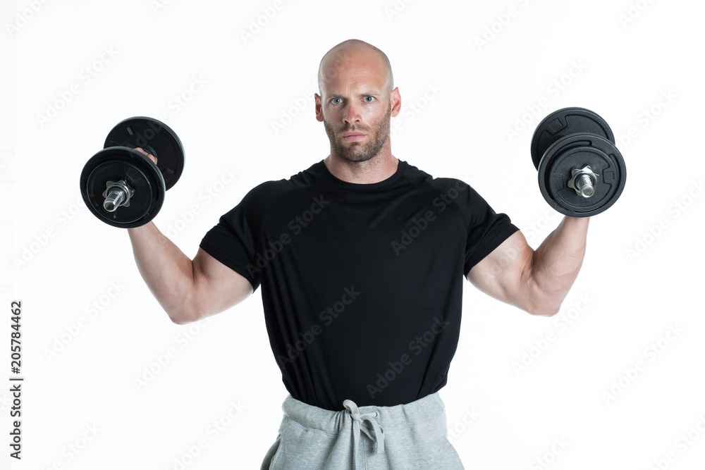 Athletic body builder pumping up muscles with dumbbells on white background Athletic body builder pumping up muscles with dumbbells on white background