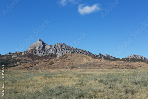 Rocks of the extinct volcano KaraDag in autumn day