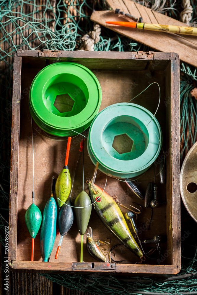 Closeup of vintage fishing tackle with fishing rod and lures Stock Photo