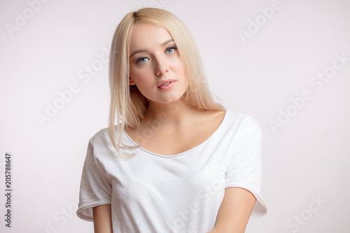 close up portrait of gorgeous blon woman with long healthy hair photo