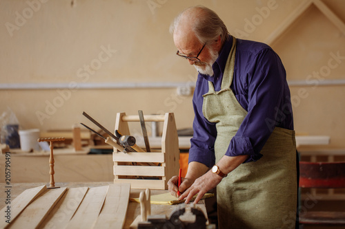 measure thrice and cut once. elderly male is earning money for leaving photo