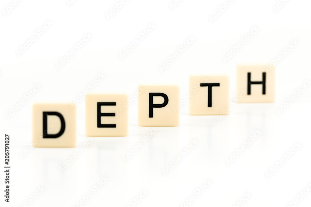 the word DEPTH on plastic boards isolated on white background with copy space the word DEPTH on plastic boards isolated on white background with copy space