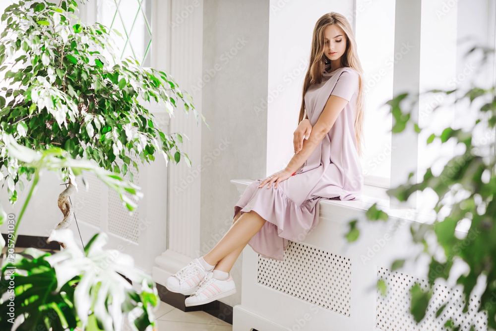beautiful girl in a gentle pink dress