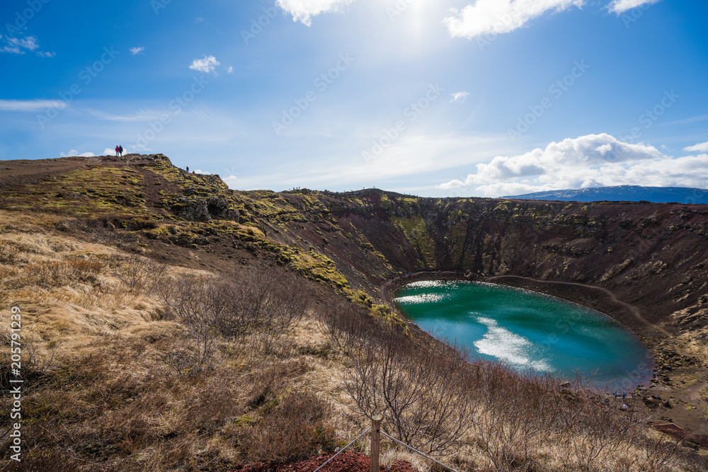 Naklejka premium Visitors climbing around Kerid Crater Lake, Iceland