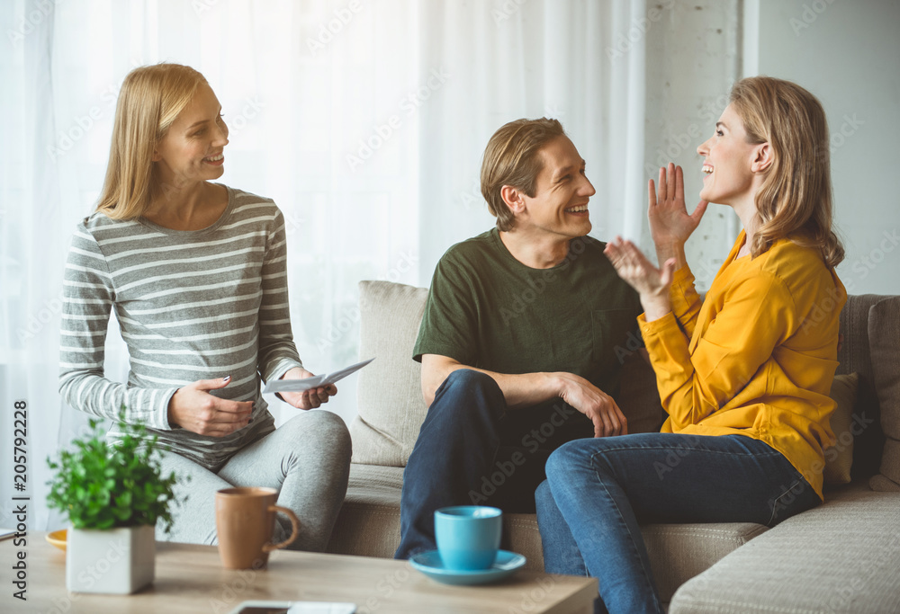 I am so glad. Excited woman is sharing her happiness about pregnancy with her husband. Man and surrogate expectant mother are smiling I am so glad. Excited woman is sharing her happiness about pregnancy with her husband. Man and surrogate expectant mother are smiling