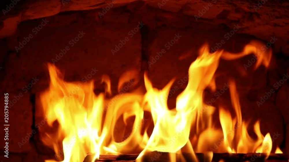 Firewood and fire flames in fireplace, bonfire close-up, 4K UHD.
Firewood and fire flames in fireplace, bonfire close-up, 4K UHD.