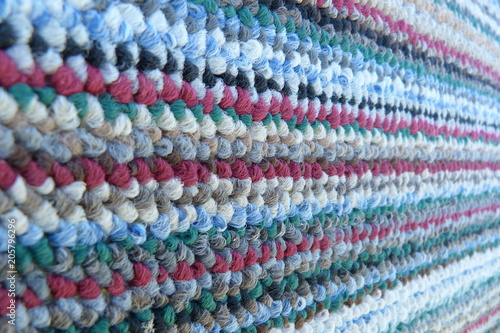knitted canvas close-up background for decor texing fabric gray burgundy blue green motley pattern stripes boucle texture bright color carpet