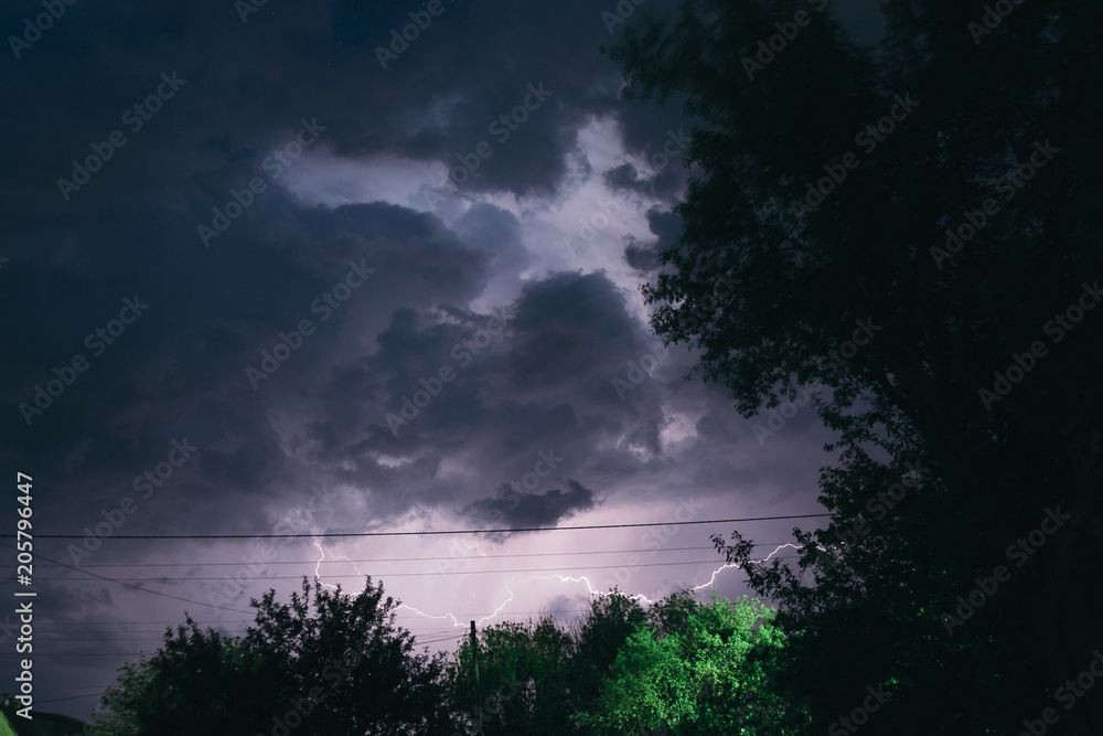 Naklejka premium Night summer thunderstorm in the countryside. Night landscape
