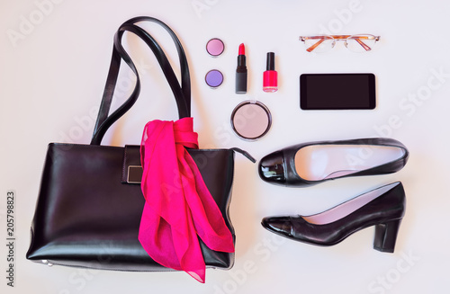  Top view of black leather bag, black shoes, smartphone, glasses and cosmetic