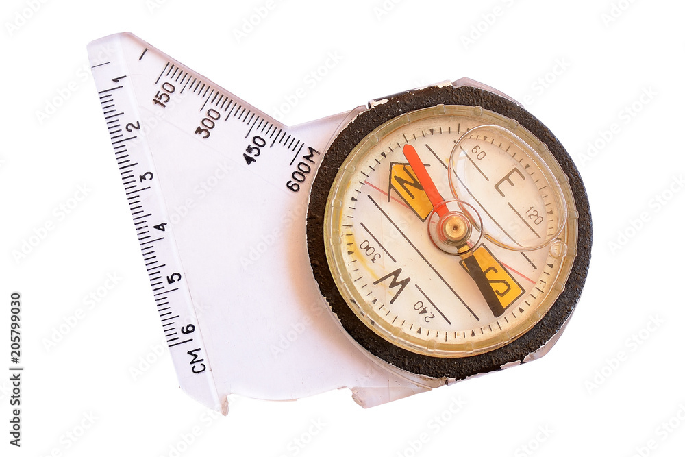 Old tourist compass with measuring scale isolated on white background Old tourist compass with measuring scale isolated on white background
