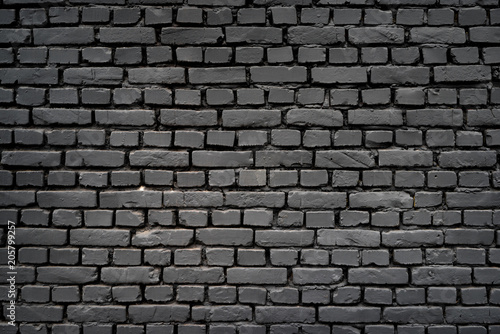Black wall as background, texture of a black brick wall