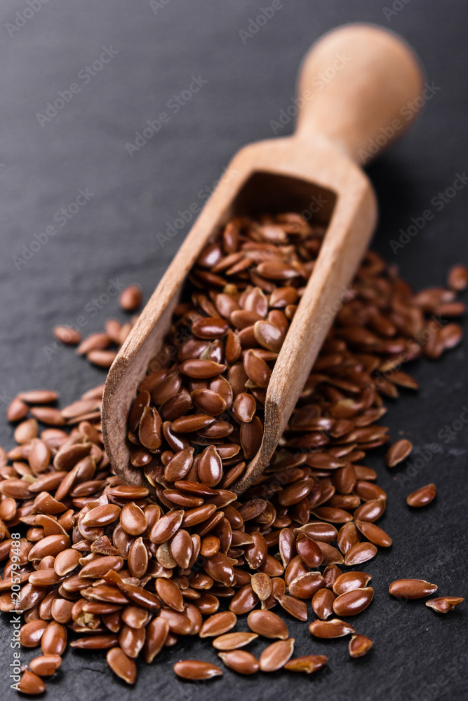 flaxseed and oil on a rustic background flaxseed and oil on a rustic background