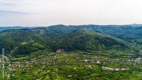 Aerial view of Carpathian mountains in summer. Village in the mountains.