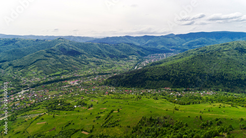 Aerial view of Carpathian mountains in summer. Village in the mountains.