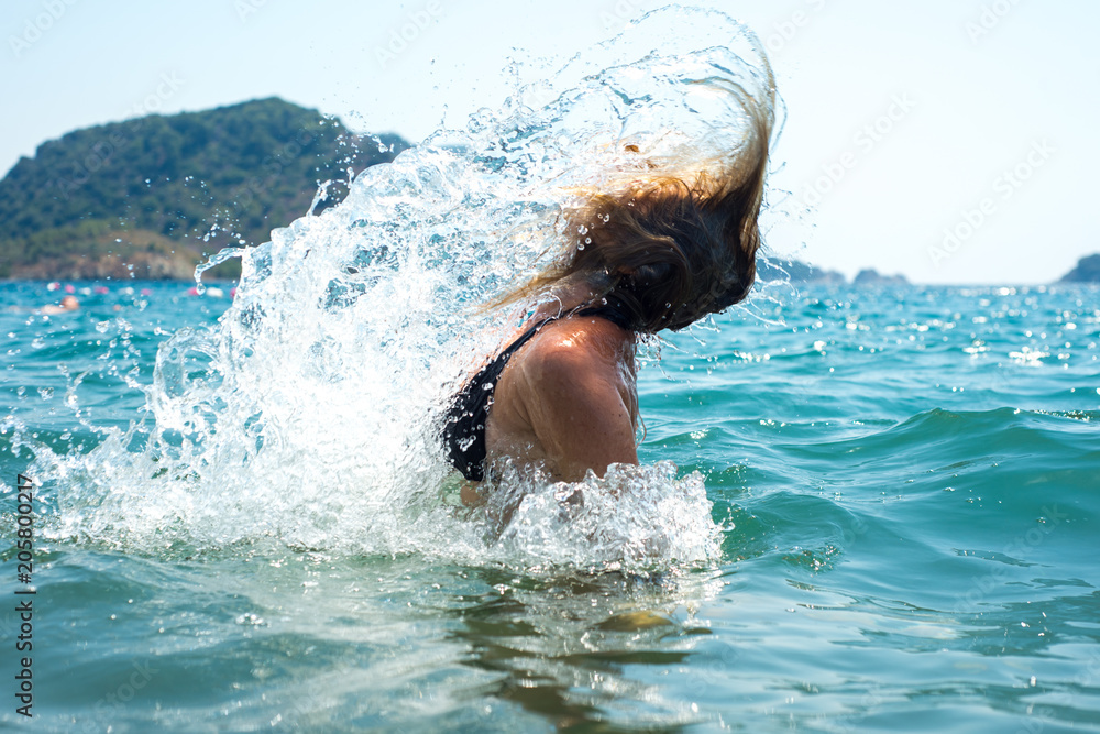 Girl splashing in the sea