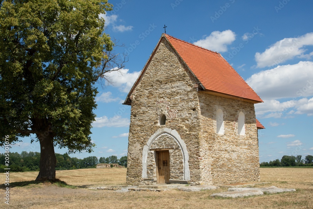 Fototapeta premium Stone medieval church St. Margita from 9th century, near village Kopcany, western Slovakia