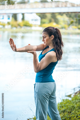 Beautefull girl with fitness exercise for relax and healthy at lake, Nature background, Concept outdoor sport and health photo