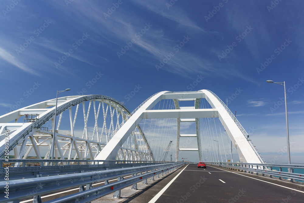 Cars go on the Crimean automobile bridge connecting the banks of the Kerch Strait