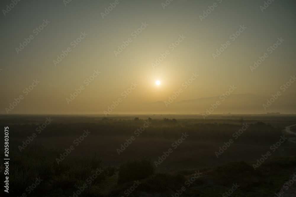 Foggy sunrise - Stock Image