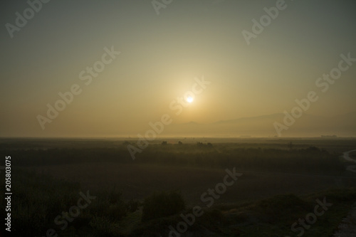 Foggy sunrise - Stock Image